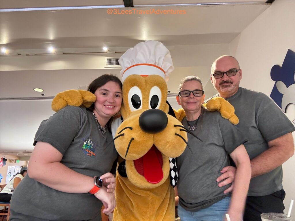 Pluto always has a Wag in his Tail and Time for a Picture with his Friends, even when hosting them for a meal at Chef Mickey’s.