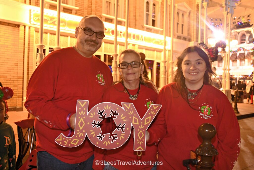 3 Lee's Travel Adventures enjoyed getting the Joy Photo Op before the Mickey's Once Upon a Christmastime Parade.