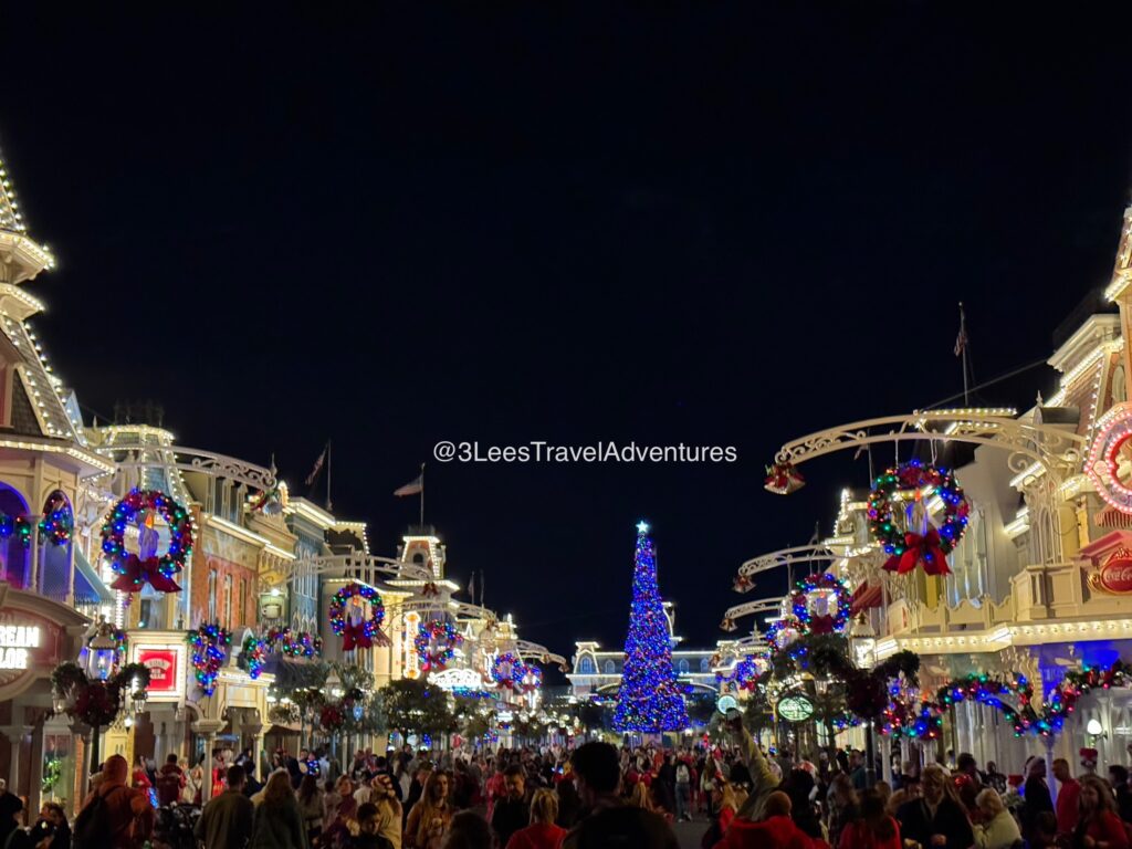 Main Street, USA at the Magic Kingdom is beautiful all lite up at night during the Christmas Season with it's Iconic Larger-than-Life Christmas Tree.