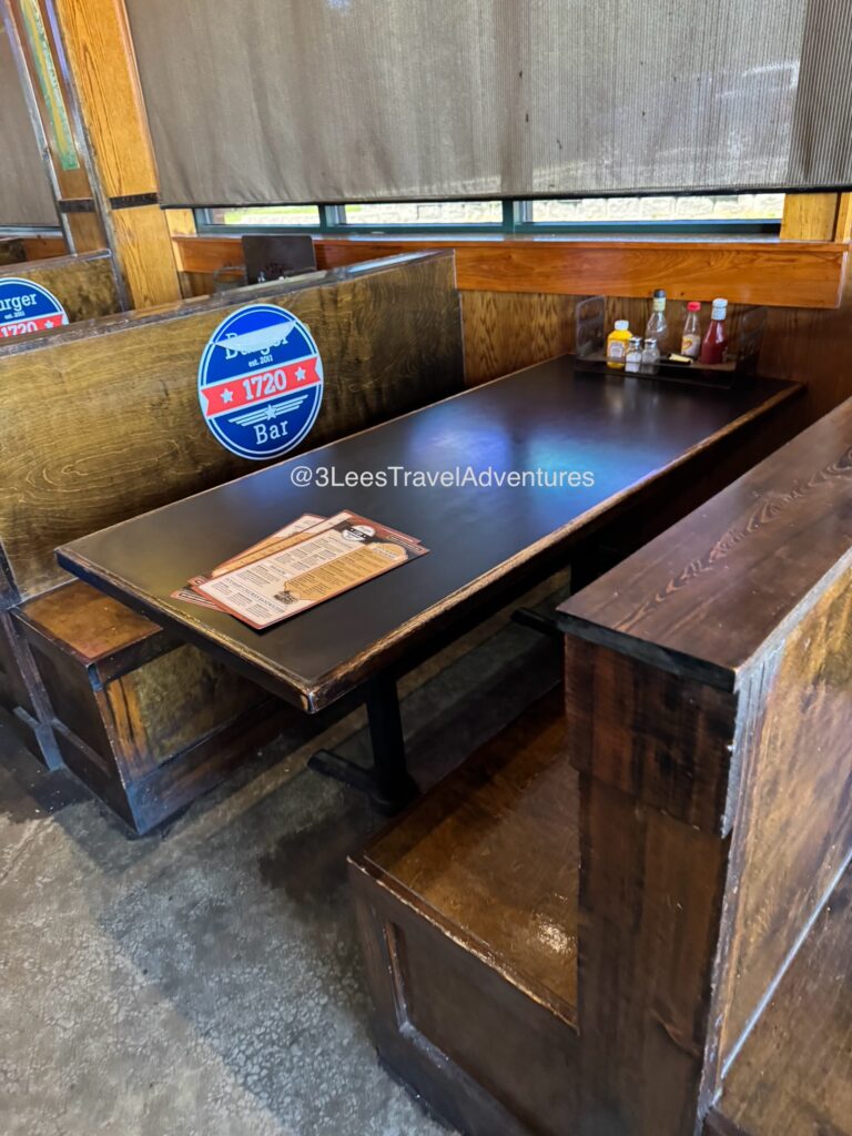 1720 Burger Bar in Florence, Sc provides Large Booths for Guests to Dine at. They also have a few Tables and Chairs.