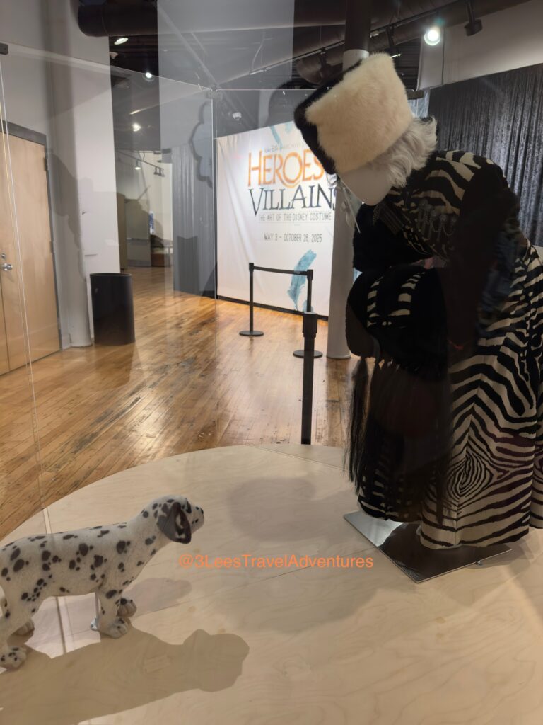 We were glad to see Cruella de Vil (One of Our Favorites) had multiple displays at the Walt Disney Archives Presents: The Art of the Disney Costume Exhibit at the South Carolina State Museum on June 21, 2025.