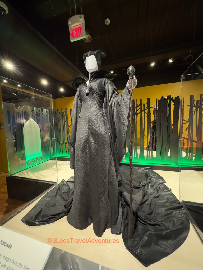 The Mistress of Evil loomed over the Visitors to Walt Disney Archives Presents Heroes & Villains: The Art of the Disney Costume. We hope her visit to Columbia, SC is Pleasant. We enjoyed seeing this Costume on June 21, 2025.