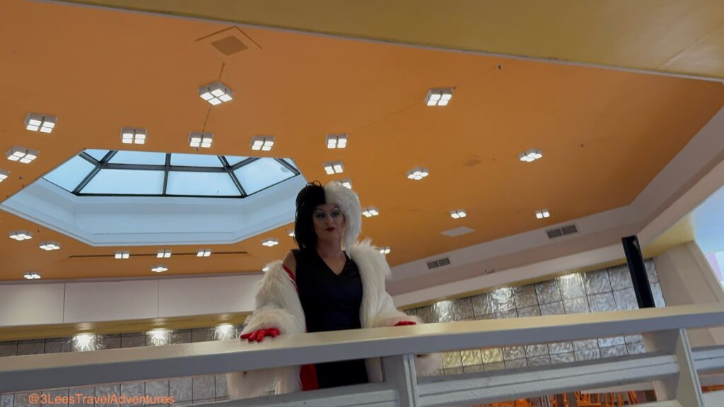 We were so glad that the rain did not keep Cruella de Vil from making an appearance. We would not want for her furs to get ruined. She was chatting with Party Goers from the Balcony at the Tomorrowland Terrace during the August 24, 2025 Mickey's Not-So-Scary Halloween Party.