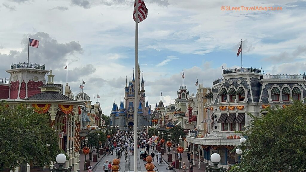 The View of Cinderella's Castle and Main Street, U.S.A. from the Balcony of the Train Station is Magical. Add in some Fall Decorations, and you just kicked the Magic of this Magic Kingdom View up several notches.
