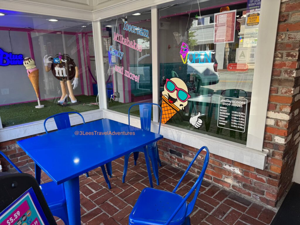 Smiling Scoops does feature a Table for Outdoor Seating. While the area may be on the smaller side, it is covered. Hours are Subject to Change.